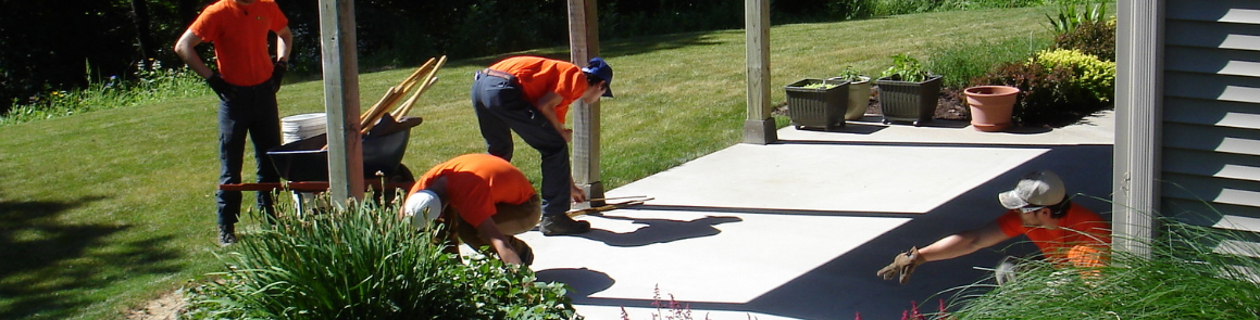 Students constructing a deck outside